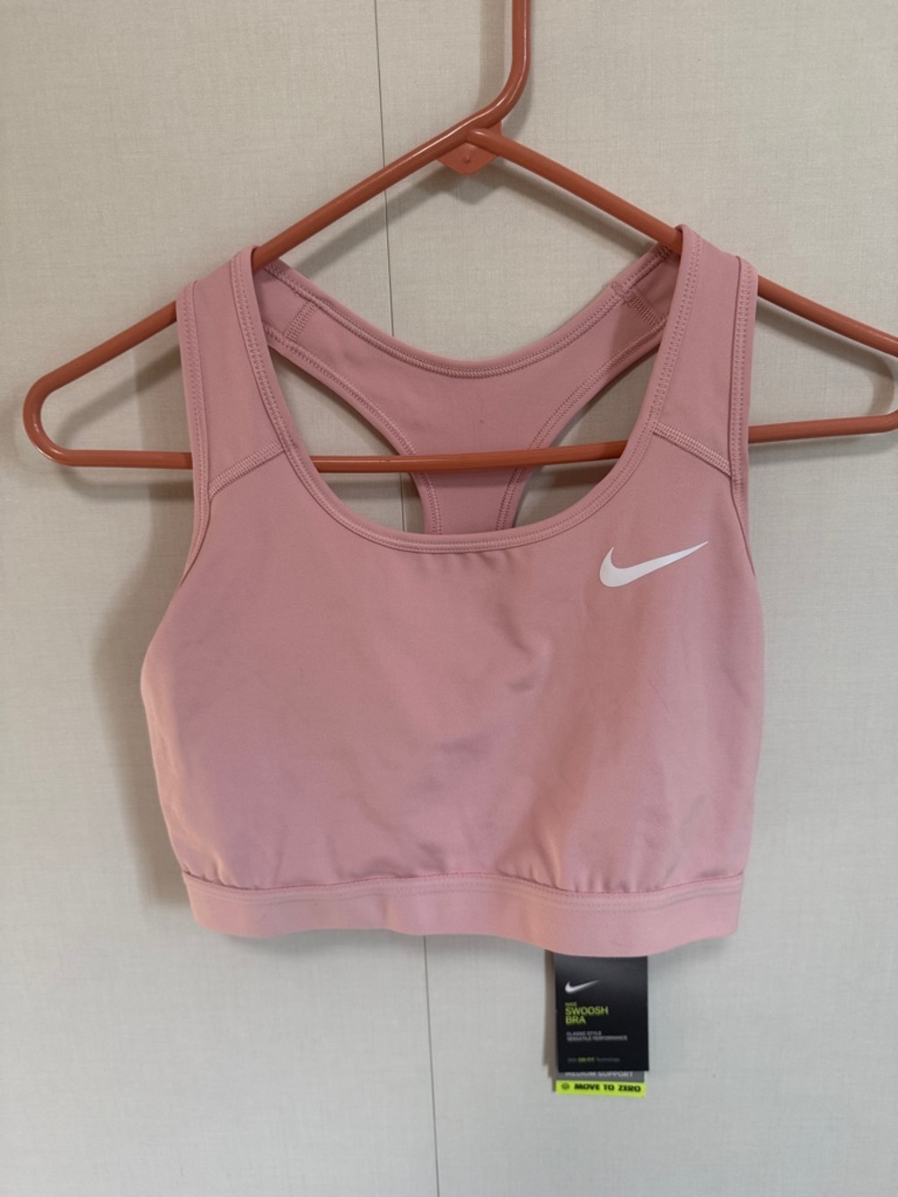 Nike Light Pink Racerback Sports Bra with White Swoosh